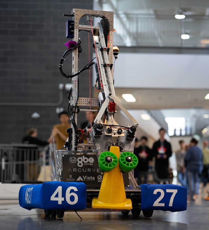 The Thor robot from 2023, picking up a yellow traffic cone